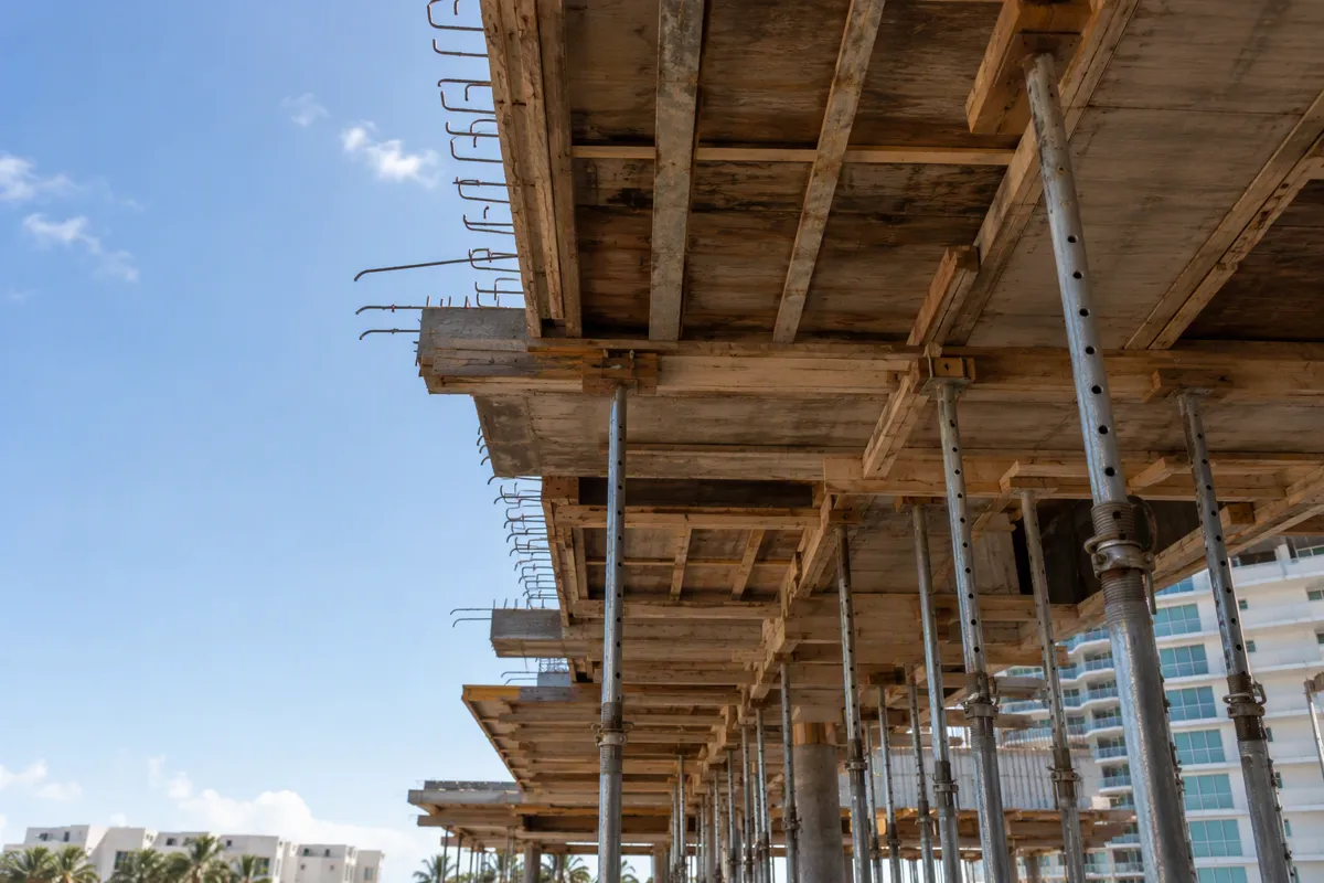 Photorealistic shoring inspections West Palm Beach scene with elevated concrete slab formwork and tower.