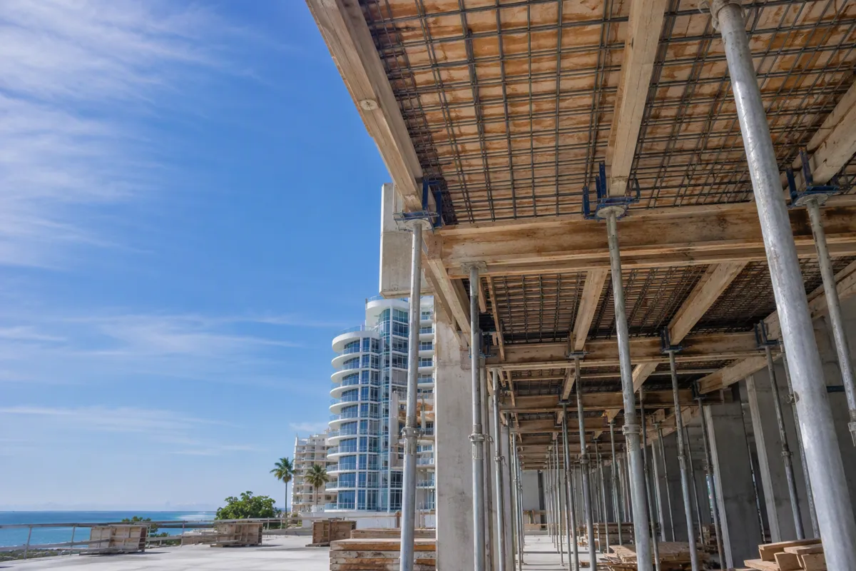 Shoring inspections Miami Beach: elevated-slab formwork and shoring posts at a coastal construction site.