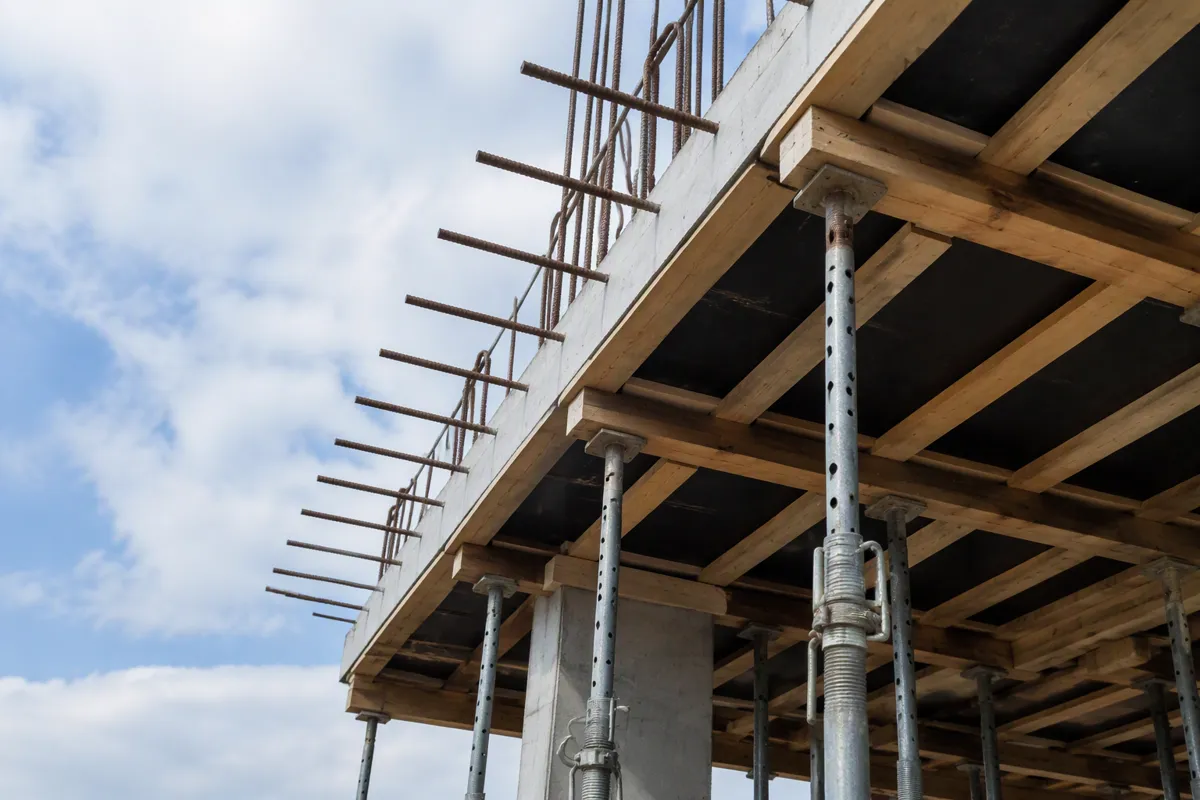 Elevated slab formwork inspection with shoring posts at a South Florida construction site