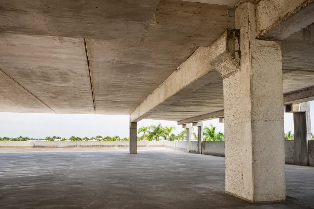 South Florida condo tower during 40-year recertification structural inspection with ocean view.